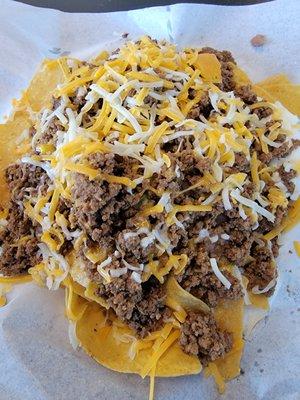 1/2 order super nachos with ground beef, beans, shredded cheese,guacamole.  Most delicious Mexican food I have had ! Free salsa bar too!!