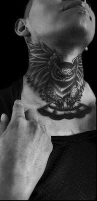 Owl throat tattoo