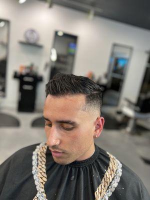 Combover with low skin fade by Luis the Barber.