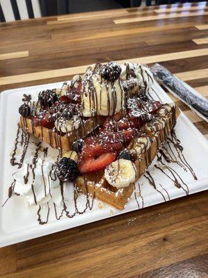 Belgian waffle with Nutella, banana, strawberry, and mixed berries. Of course they also had whip cream and a scoop of vanilla ice cream!!