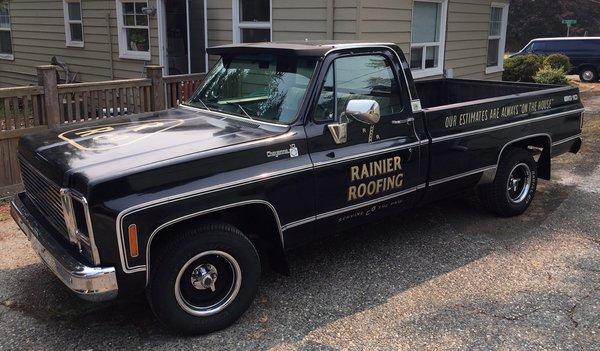 Hand painted logos and lettering for Rainier Roofing work truck