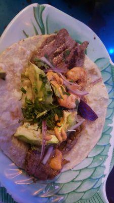 Surf and turf taco is $6.50. Only three little shrimp