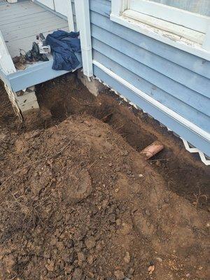 Trench Screening pier and beam home to keep animals from digging into the crawl space!