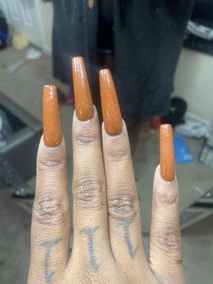 Nails are obviously cricked asf & not all the same shape . her work is terrible