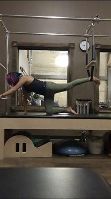 Kim using the Cadillac Push Through Bar and Swing.