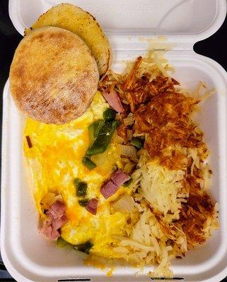 Huge omelet with crispy hashbrowns and English muffin