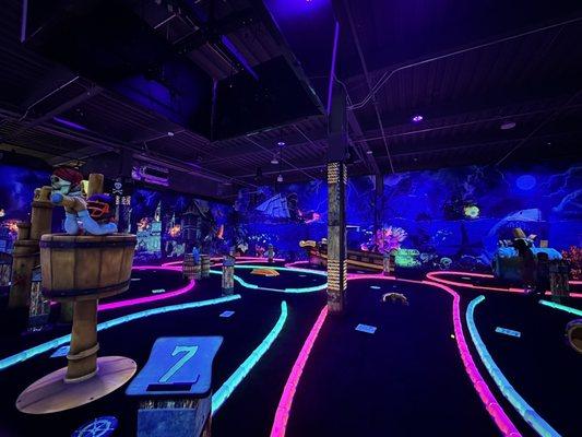 Indoor glow in the dark mini golf