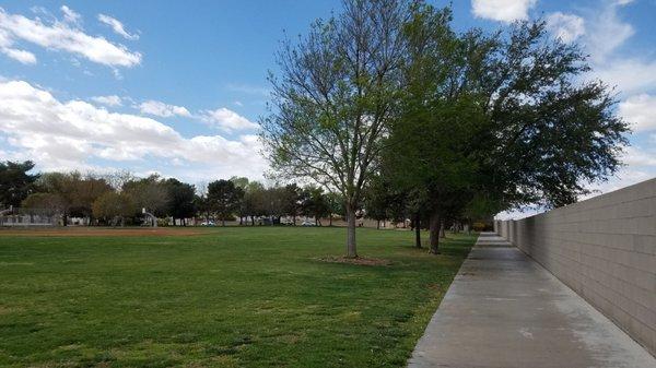 Facing west along the north periphery wall that separates the park from the Union Pacific Railroad.