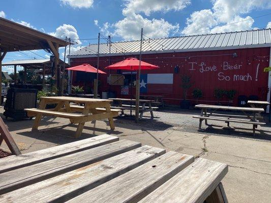 Patio outside the store. Bar across the ways.