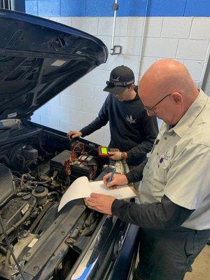 Brian and his apprentice Tyson performing a PPI Pre-purchase inspection. The customer used the PPI findings to negotiate a price.