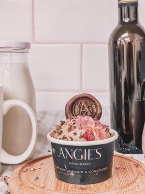 Our cappuccino flavor topped with cacao nibs, edible flowers, and The Angie's Stamp