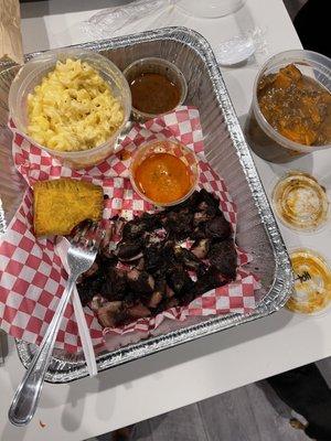 Pork, Mac n cheese, and yams. Includes 2 Jamaican Beef Patties. Feeds 2 people.