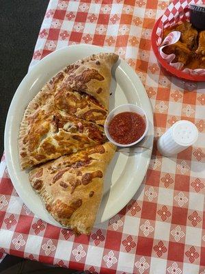 This is what they call a Stromboli.  I think it is a calzone everywhere else on the planet.