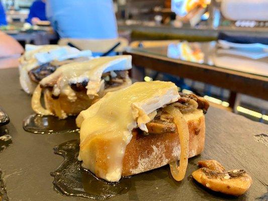 These Brie and mushroom topped bruschetta were amazing! About $3 each...