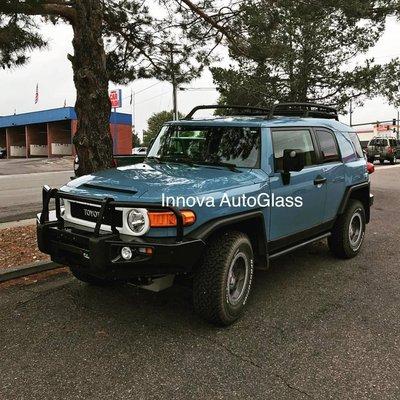 2013 Toyota FJ Full windshield replacement Free estimates and appointments at 303-997-7394