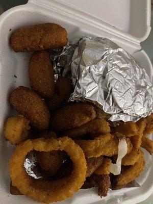 Cajun chicken platter with hush puppies and Onion rings