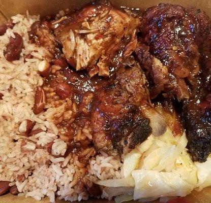 medium jerk chicken with cabbage and rice & peas in a very spicy sauce