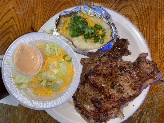 16oz ribeye, baked potato and salad