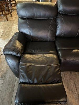 (After) Reupholstered and made better than before.  The company used real leather to replace the vinyl it connected to.