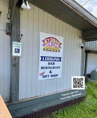 The simple sign advertising lodge, bar, restaurant, & gift shop (coming soon)