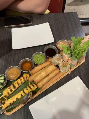 Sampler 19: chicken satay, dumplings, cheese rolls, soft spring rolls, crispy rolls