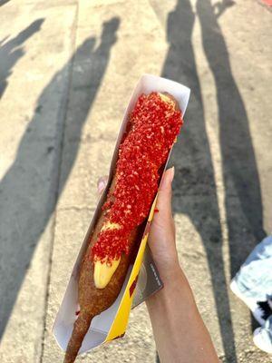 foot long corn dog covered with hot cheetos!