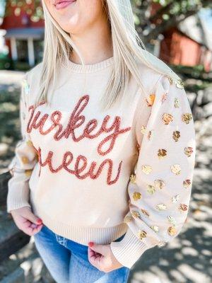 Be the Turkey Queen this Thanksgiving. There are mini Turkeys on the sleeves.