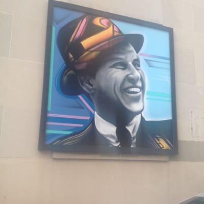 Check it out- it's Old Blue Eyes, Frank Sinatra. This piece of art is found adorning a wall in the alley behind Churchill's.