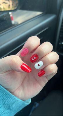 Gel Manicure with heart decals.