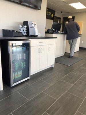 Clean waiting room stocked with beverages