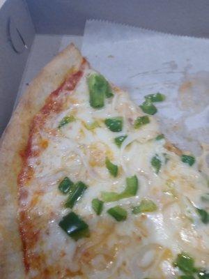 A veggie slice with green peppers and onion