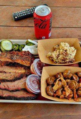 2 Meat Plate: Moist Brisket, Pork Ribs, Sautéed Mushrooms, and Cajun Rice.