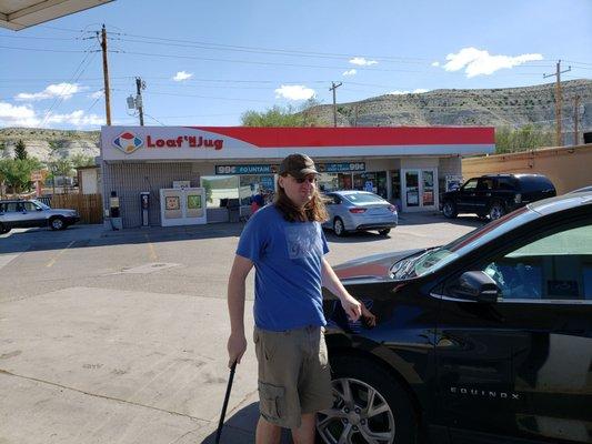 Billy is wiping windows at the loaf n jug