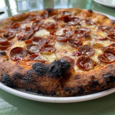 Pepperoni pizza with honey