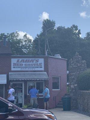 Faithful customers ordering at the window since they're indoor seating is currently closed for covid safety precautions.