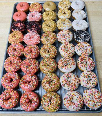 Assortment of iced cake donuts