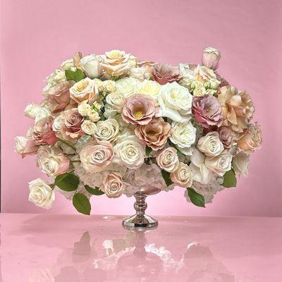 The charm of blush tea roses. Pastel cream and a juicy tones add a modern twist to this floral design.