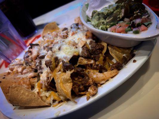 LOCO A15. Nachos Locos with steak, chicken & shrimp