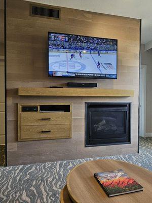 Entertainment center with Bose sound bar and gas fireplace.