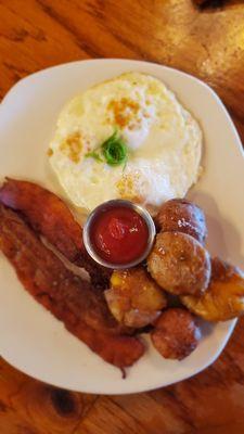 Classic three egg breakfast with smashed potatoes and extra crispy bacon!