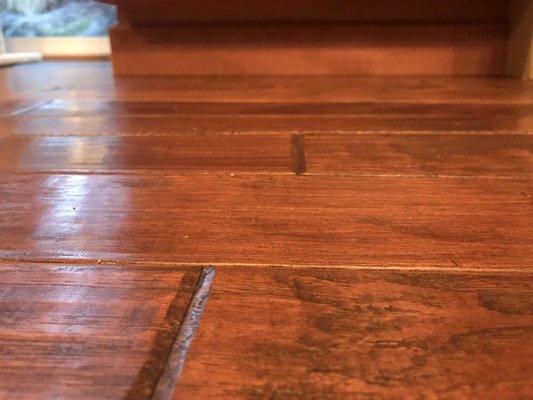 Warped hardwoods from the leak they caused.