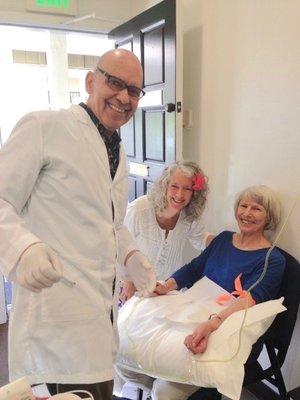 Dr. Connie and Dr. Marcel entertain an IV patient