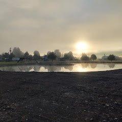 Pond and Misty Mountains at Sunrise