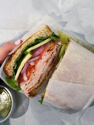 Medium build your own: wheat bread, Cracked Pepper Turkey, lettuce, tomato, onion, and cucumber with spicy brown mustard