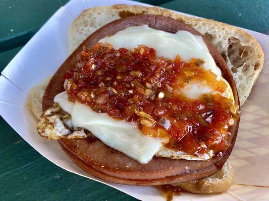 Bologna, egg, cheese, and hot pepper relish on salty bread