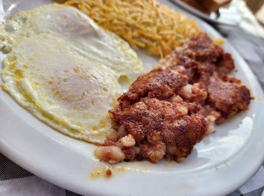 Corn beef hash, with over-easy egg.