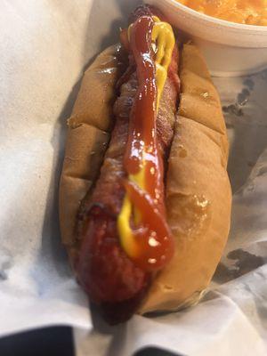 Bacon dog with ketchup and mustard