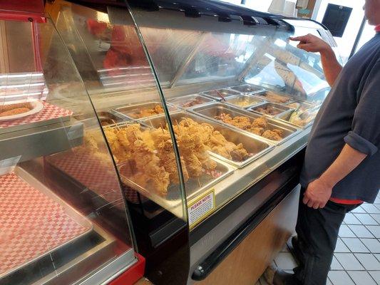 Fried chicken and hot food counter.