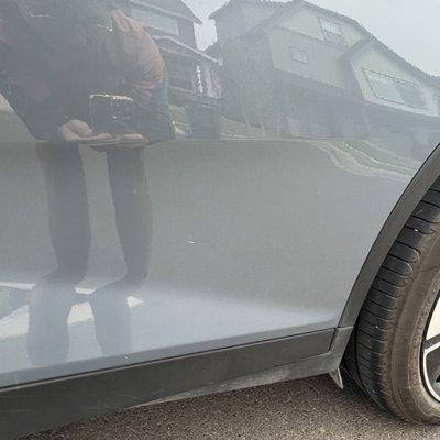 Marks, scratches and chips on the paint at the time of receiving the vehicle from Hertz.