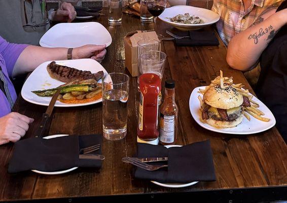 El Moro Burger* Pasta & Prawns, and the New York Strip*